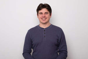156824474-smiling-young-man-handsome-man-in-a-sweater-is-smiling.jpg